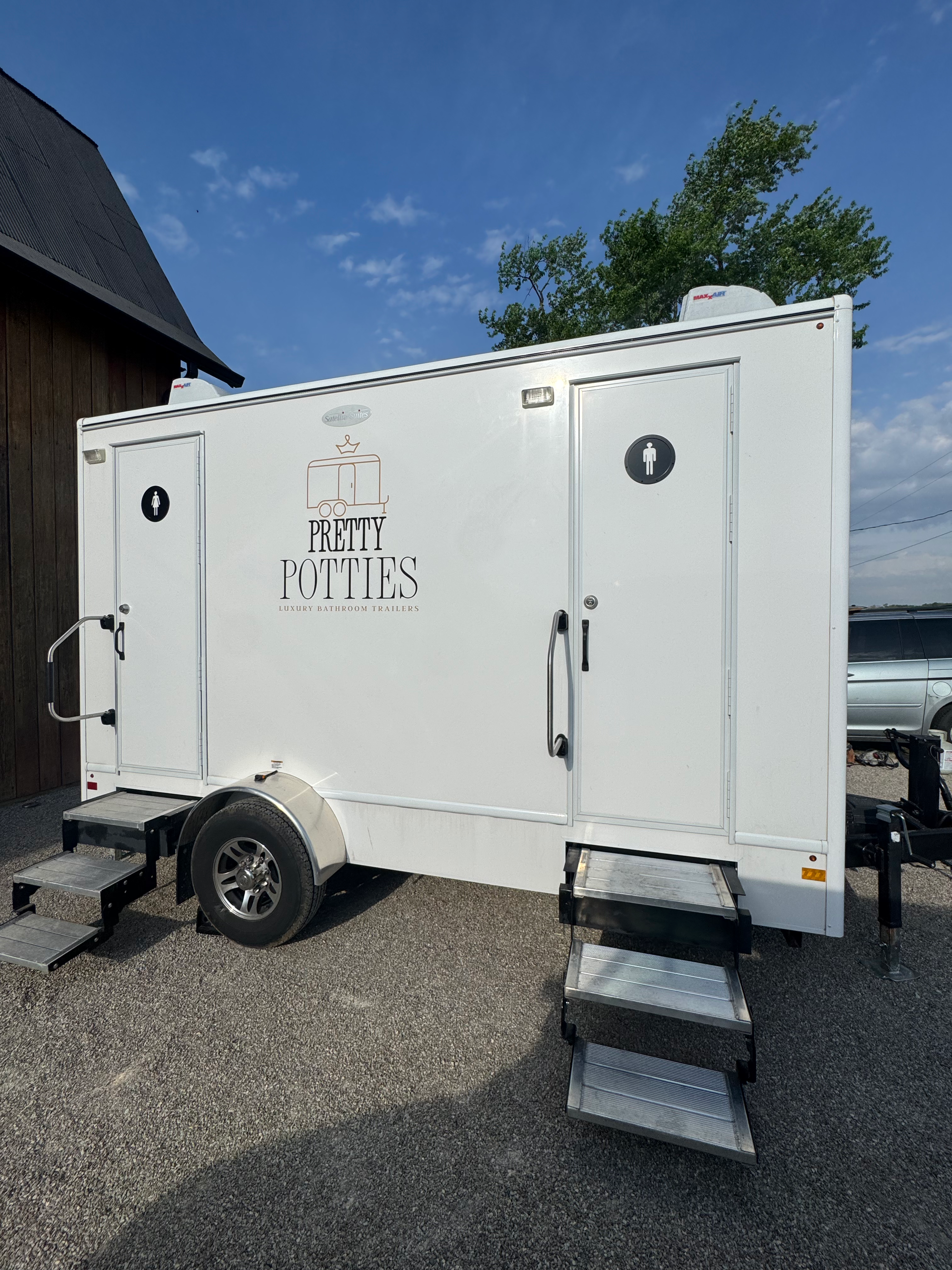 Pretty Potties luxury restroom trailer men's exterior door close-up with handrail and entry step, Indiana rental
